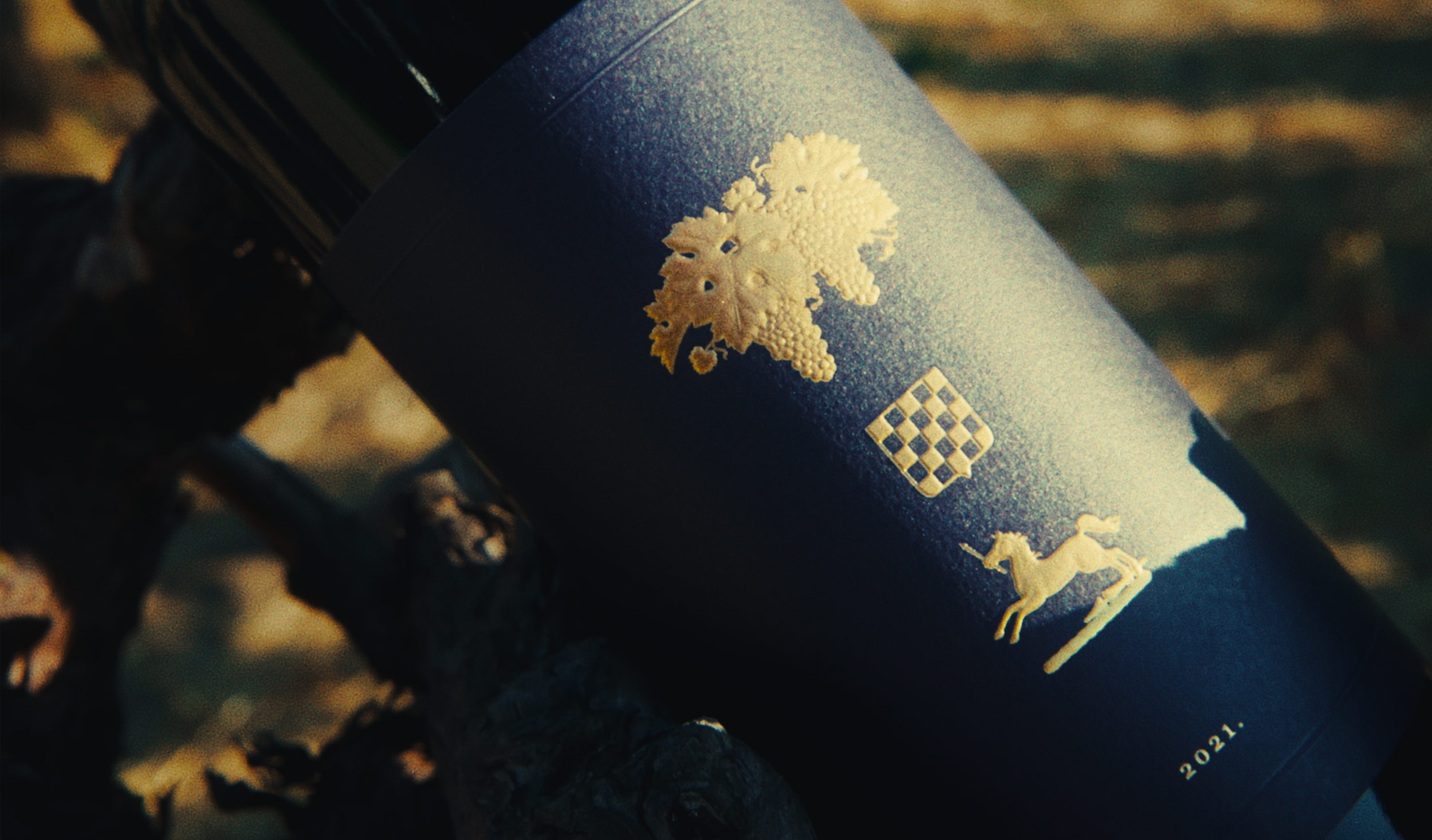 A faded image of 2021 Paradise Block Cabernet Sauvignon resting atop an old vine in Grgich Hills Estate's Yountville vineyard.