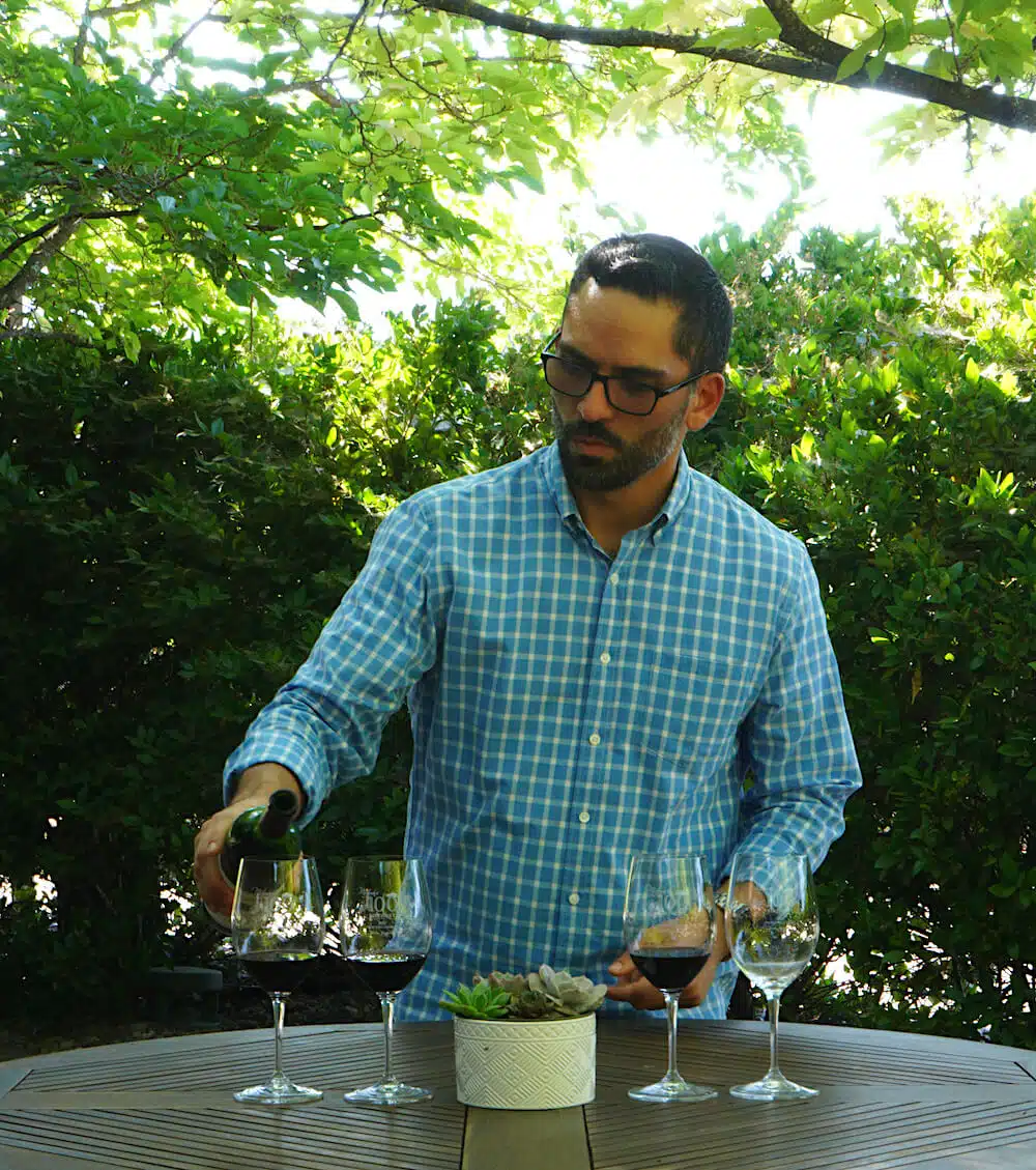 luis pouring wine