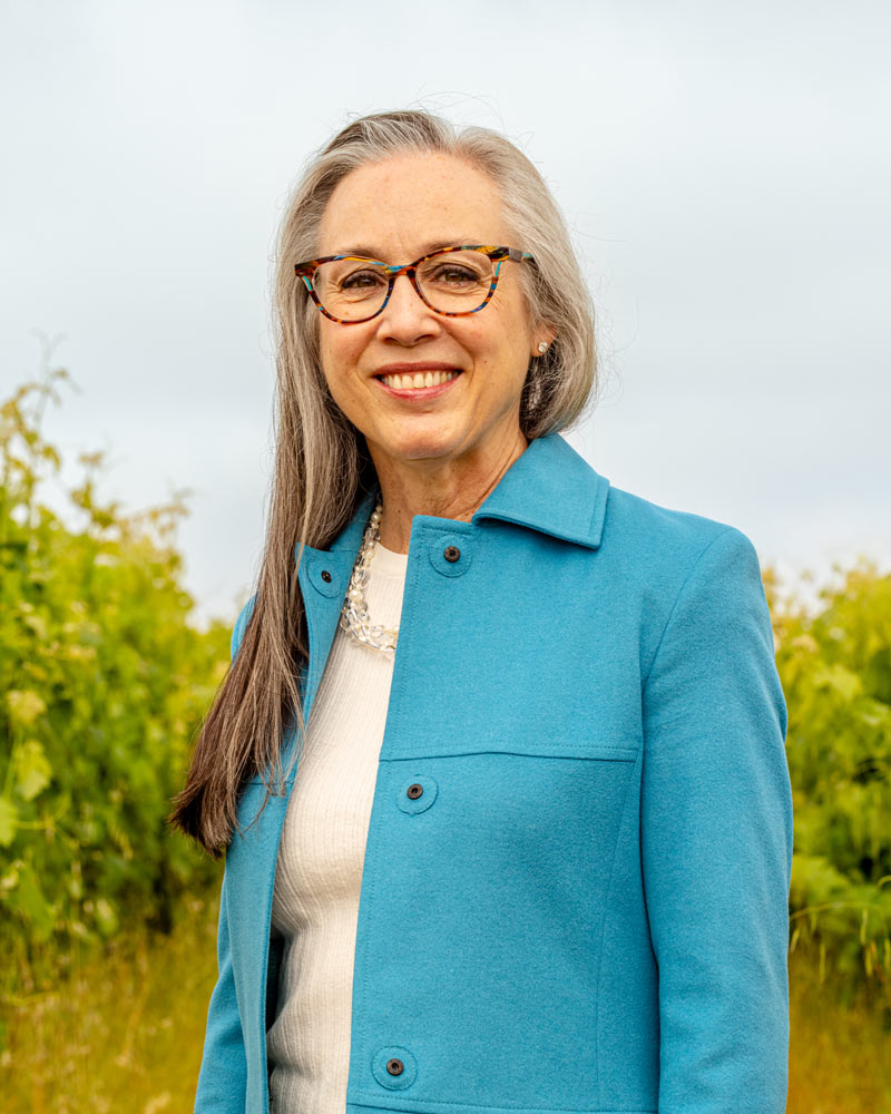 Violet Grgich, President and CEO of Grgich Hills Estate, standing in the vineyards of her Napa Valley Winery.