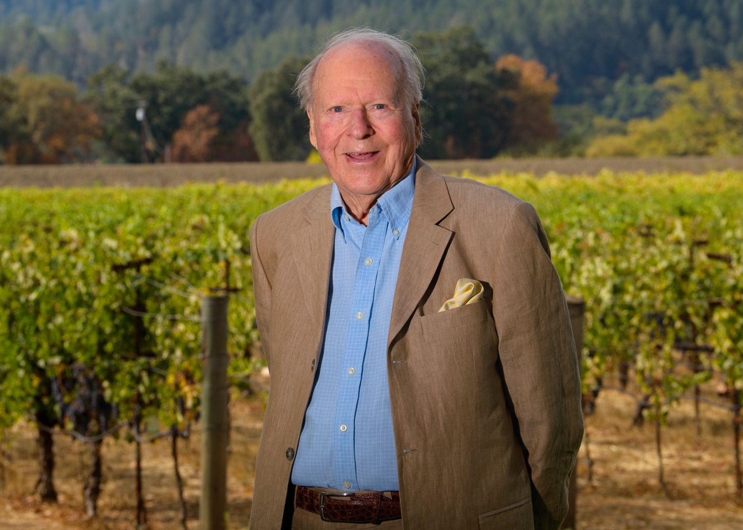 Austin Hills standing outside the Grgich Hills Estate winery next to the vineyards in Rutherford, California.