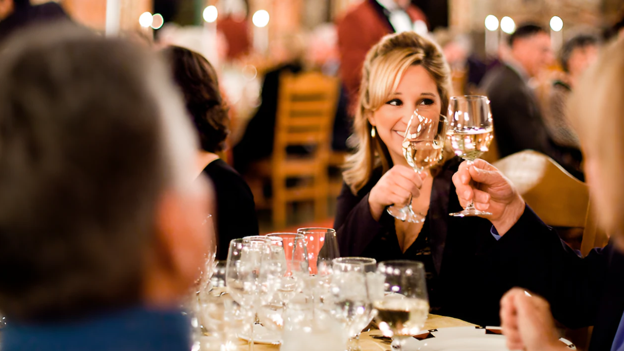 People Enjoying Wine at a Gathering